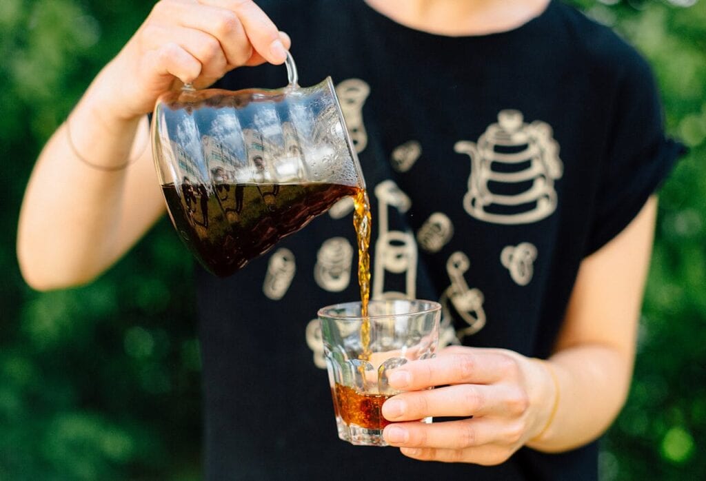 Barista brewing coffee with a pour-over method